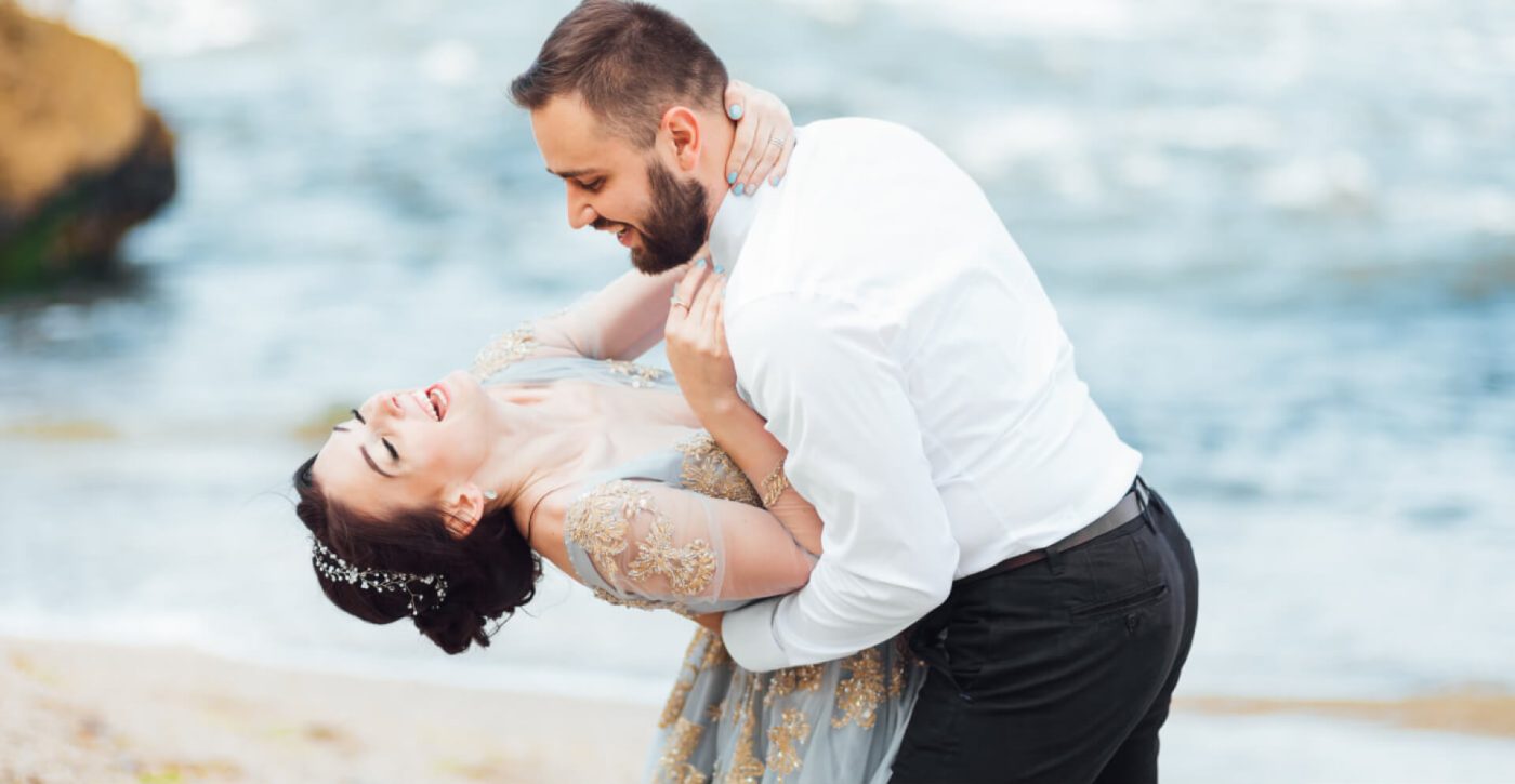 same-couple-with-a-bride-in-a-blue-dress-walk-UB8HT25.jpg
